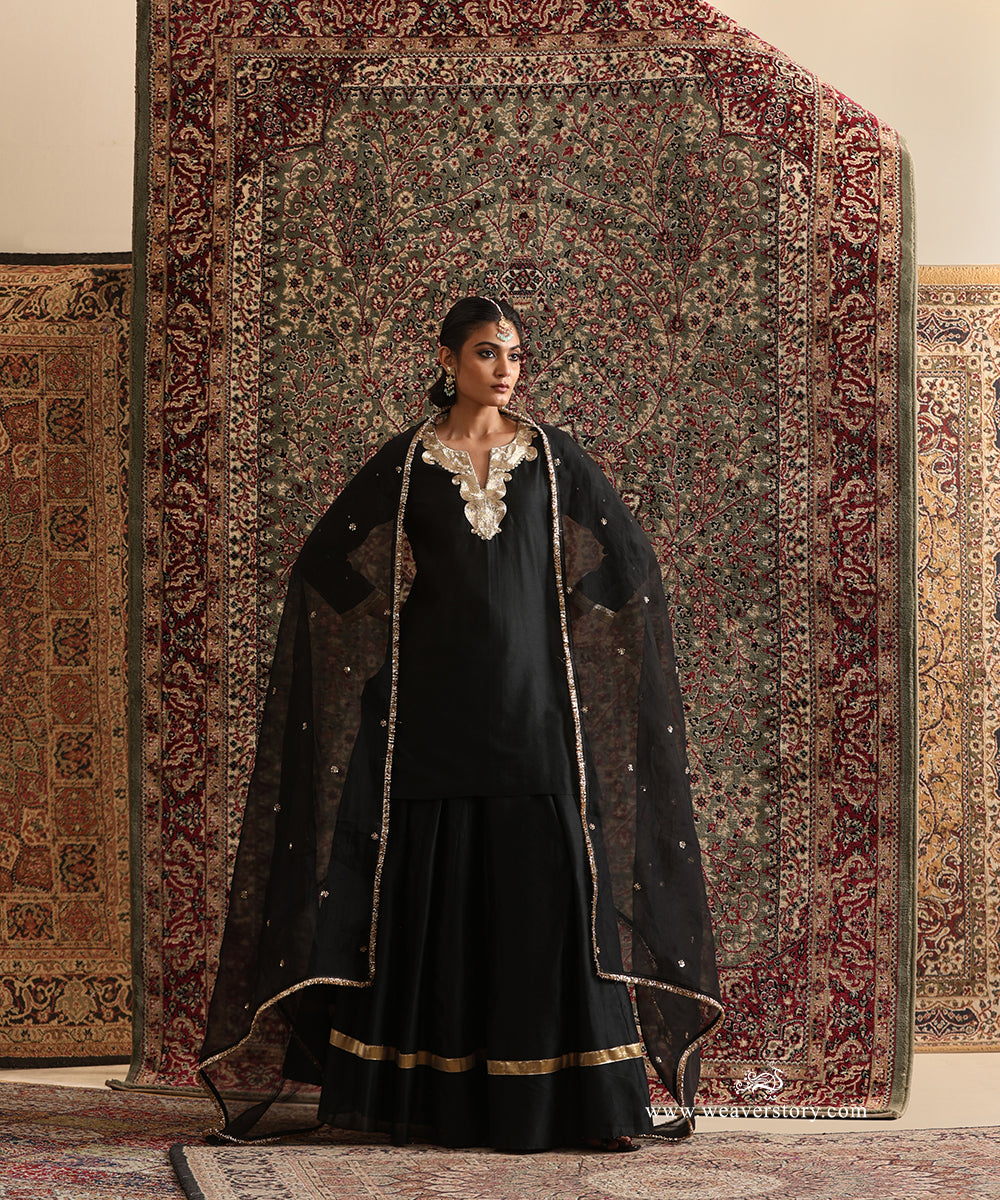 Black Chanderi silk kurta and gathered skirt styled with a pure silk organza dupatta featuring hand embroidered floral buttis