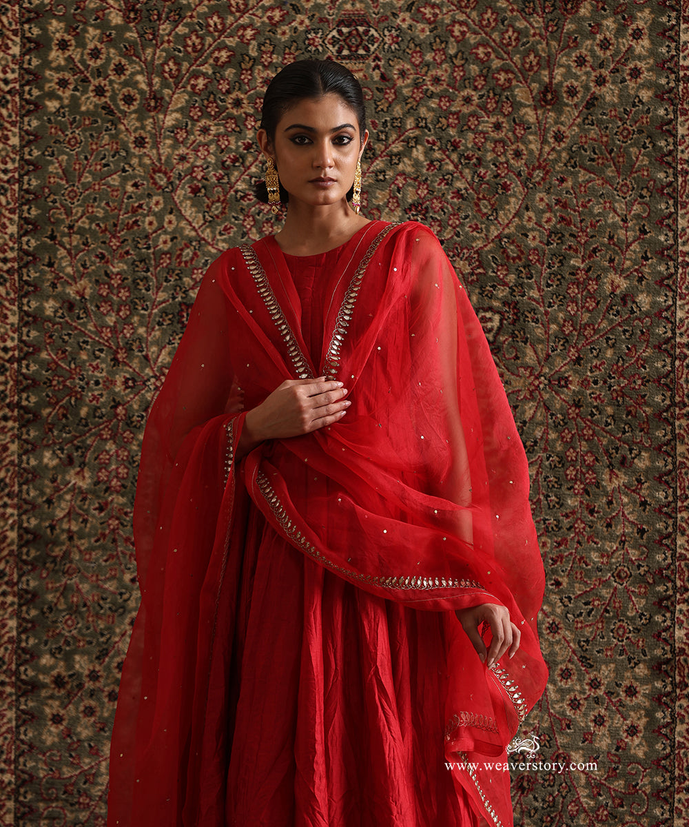 Red organza dupatta with gota embroidered border and scattered gota motifs