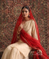 Almond Beige Organza Silk kurta and gharara set styled with contrasting red embroidered organza silk dupatta