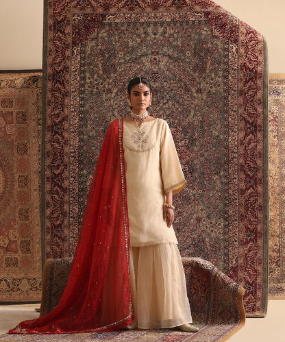 Almond Beige Organza Silk gharara set with red organza dupatta featuring scattered embroidery and gota border