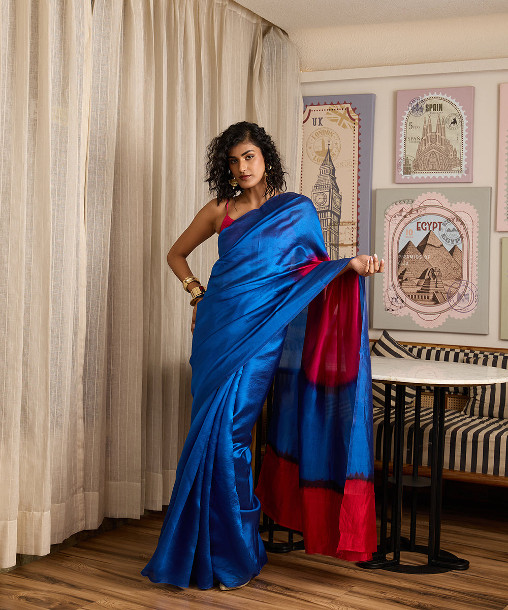 Cobalt blue pure Dupion silk Arashi Shibori saree with a large hot pink circular motif on the pallu