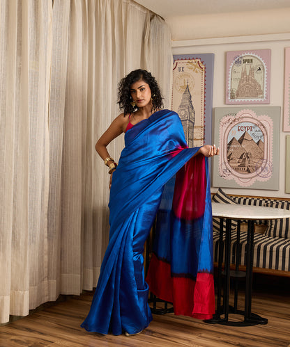Cobalt blue pure Dupion silk Arashi Shibori saree with a large hot pink circular motif on the pallu