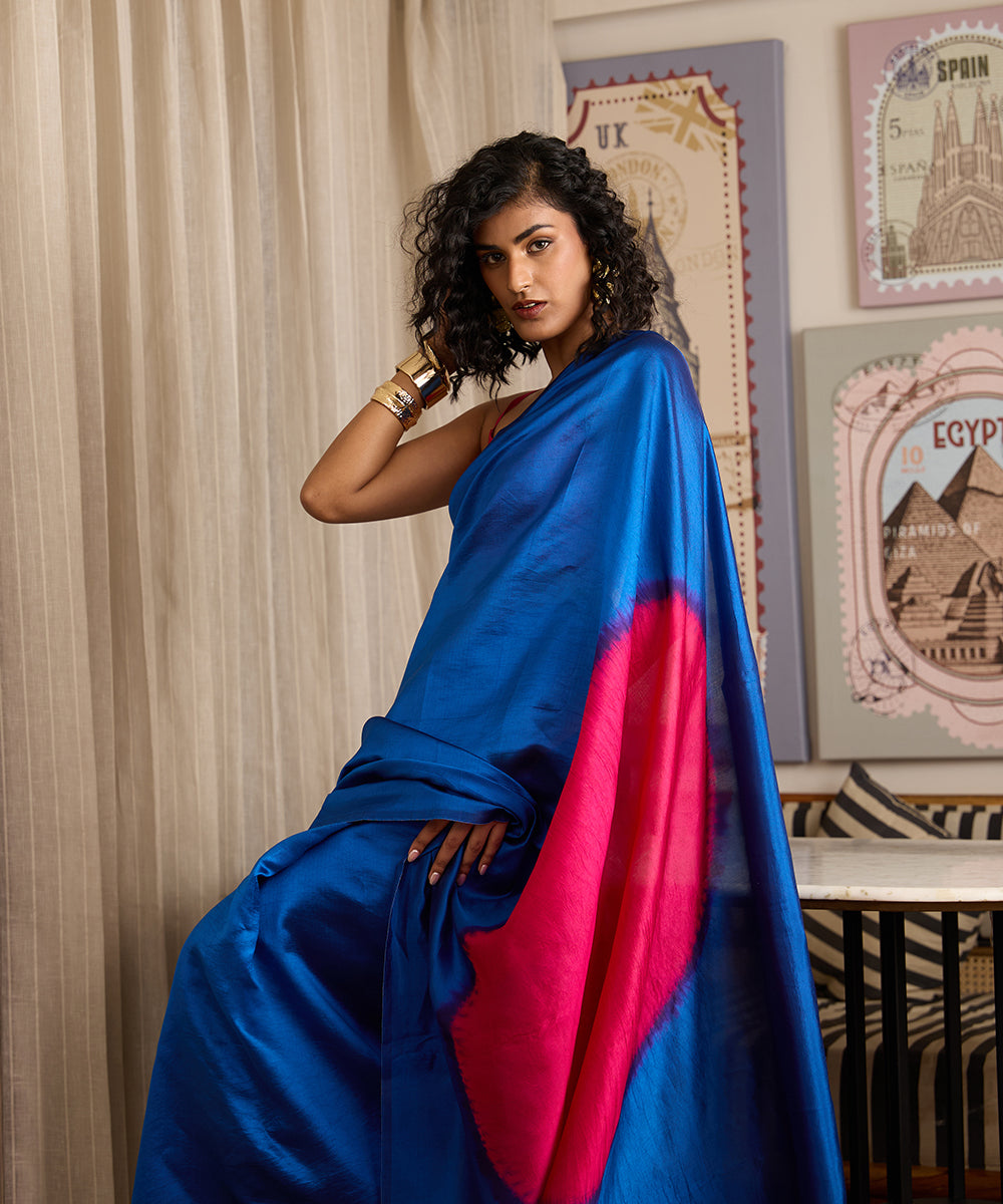 Cobalt blue Dupion silk saree featuring a hot pink Arashi Shibori pallu and contrasting pink border