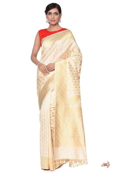 Ivory_and_gold_Kadhwa_Banarasi_Saree_with_traditional_paisley_Bootis_and_a_rich_konia_Pallu_WeaverStory_04