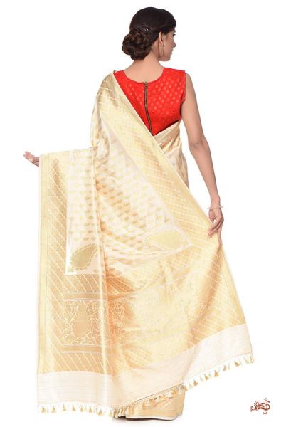 Ivory_and_gold_Kadhwa_Banarasi_Saree_with_traditional_paisley_Bootis_and_a_rich_konia_Pallu_WeaverStory_03