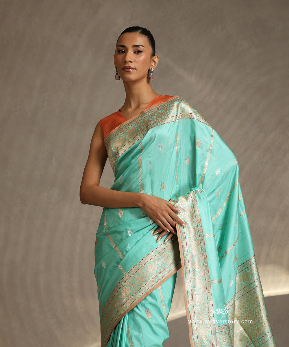 Pastel_Green_Handloom_Pure_Katan_Silk_Banarasi_Saree_With_Vertical_Stripes_WeaverStory_01