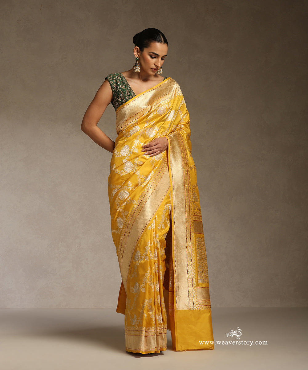 Yellow_Handloom_Pure_Katan_Silk_Kadhwa_Banarasi_Jangla_Saree_With_Silver_Zari_Meenakari_Floral_Jaal_WeaverStory_01