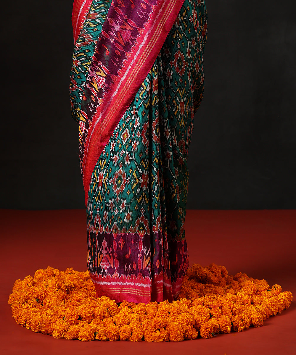 Handloom Teal Blue And Green Double Warp Pure Mulberry Silk Ikat Patola Saree With Pink Border
