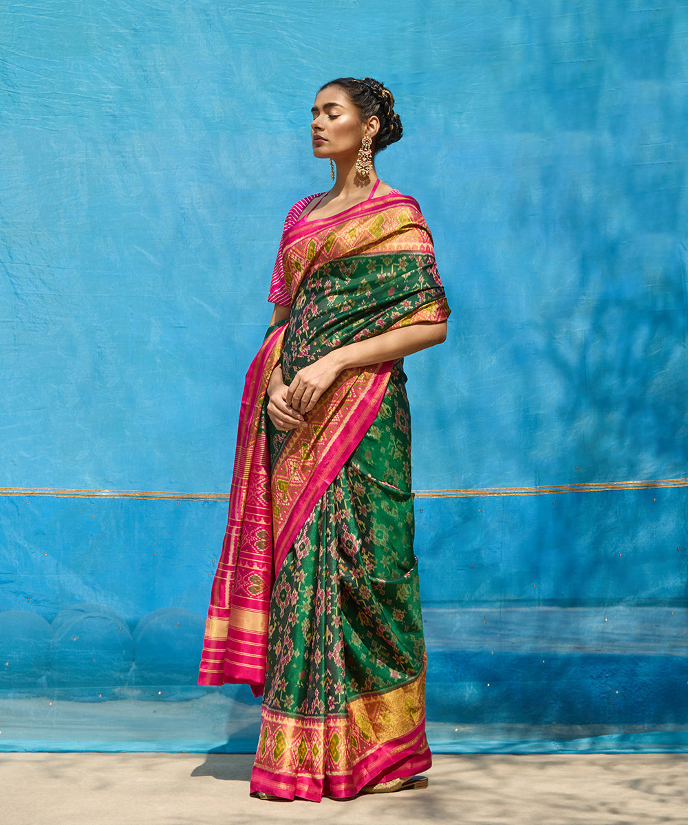 Handloom_Green_And_Pink_Pure_Mulberry_Silk_Ikat_Patola_Saree_With_Pink_Border_And_Palla_WeaverStory_01