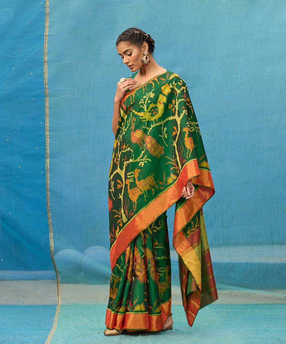 Green_And_Red_Handloom_Pure_Mulberry_Silk_Ikat_Patola_Saree_With_Deer_Motifs_WeaverStory_01