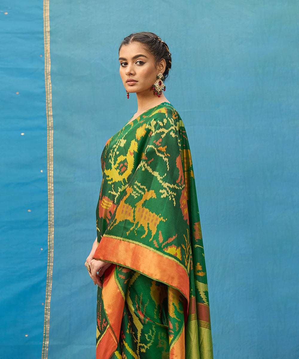 Green_And_Red_Handloom_Pure_Mulberry_Silk_Ikat_Patola_Saree_With_Deer_Motifs_WeaverStory_02