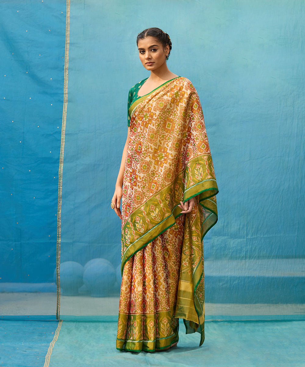 Handloom_Rust_And_Green_Pure_Tissue_Mulberry_Silk_Ikat_Patola_Saree_WeaverStory_01