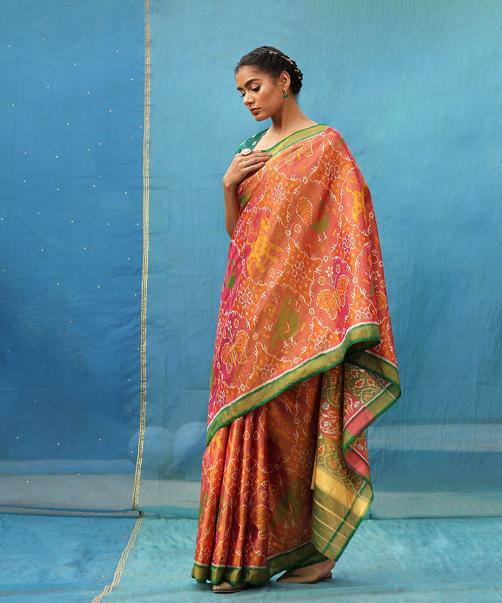 Pink_And_Green_Handloom_Pure_Tissue_Mulberry_Silk_Ikat_Patola_Saree_WeaverStory_01