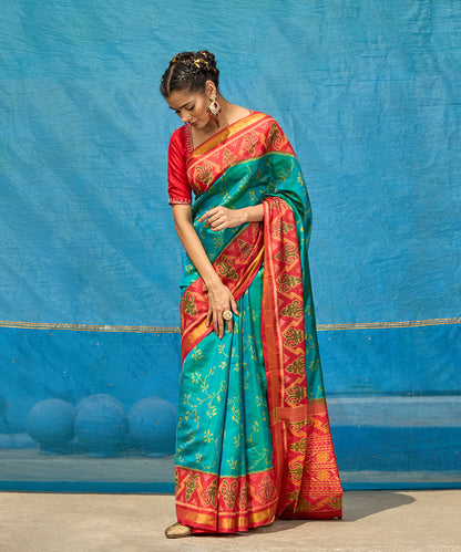Handloom_Turquoise_Blue_Pure_Mulberry_Silk_Ikat_Patola_Saree_With_Pink_Border_And_Palla_WeaverStory_01