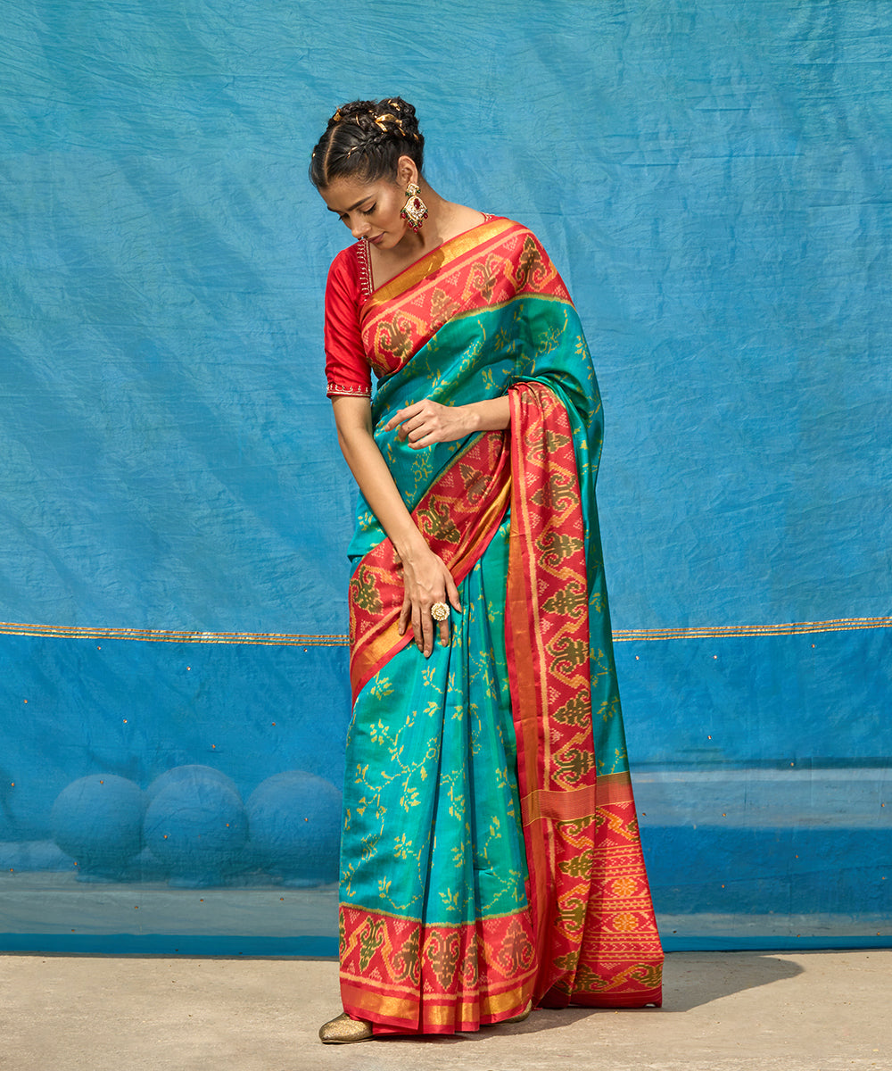 Handloom_Turquoise_Blue_Pure_Mulberry_Silk_Ikat_Patola_Saree_With_Pink_Border_And_Palla_WeaverStory_01