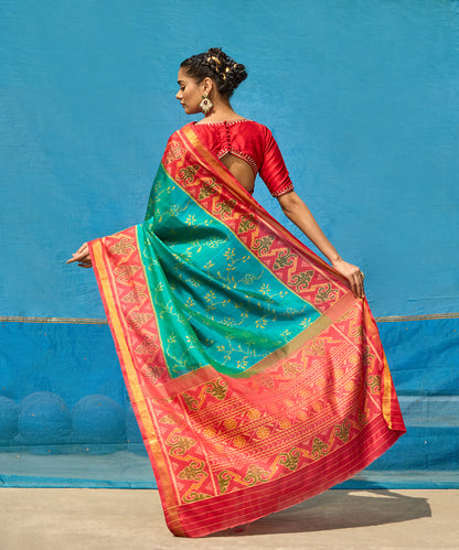 Handloom_Turquoise_Blue_Pure_Mulberry_Silk_Ikat_Patola_Saree_With_Pink_Border_And_Palla_WeaverStory_03