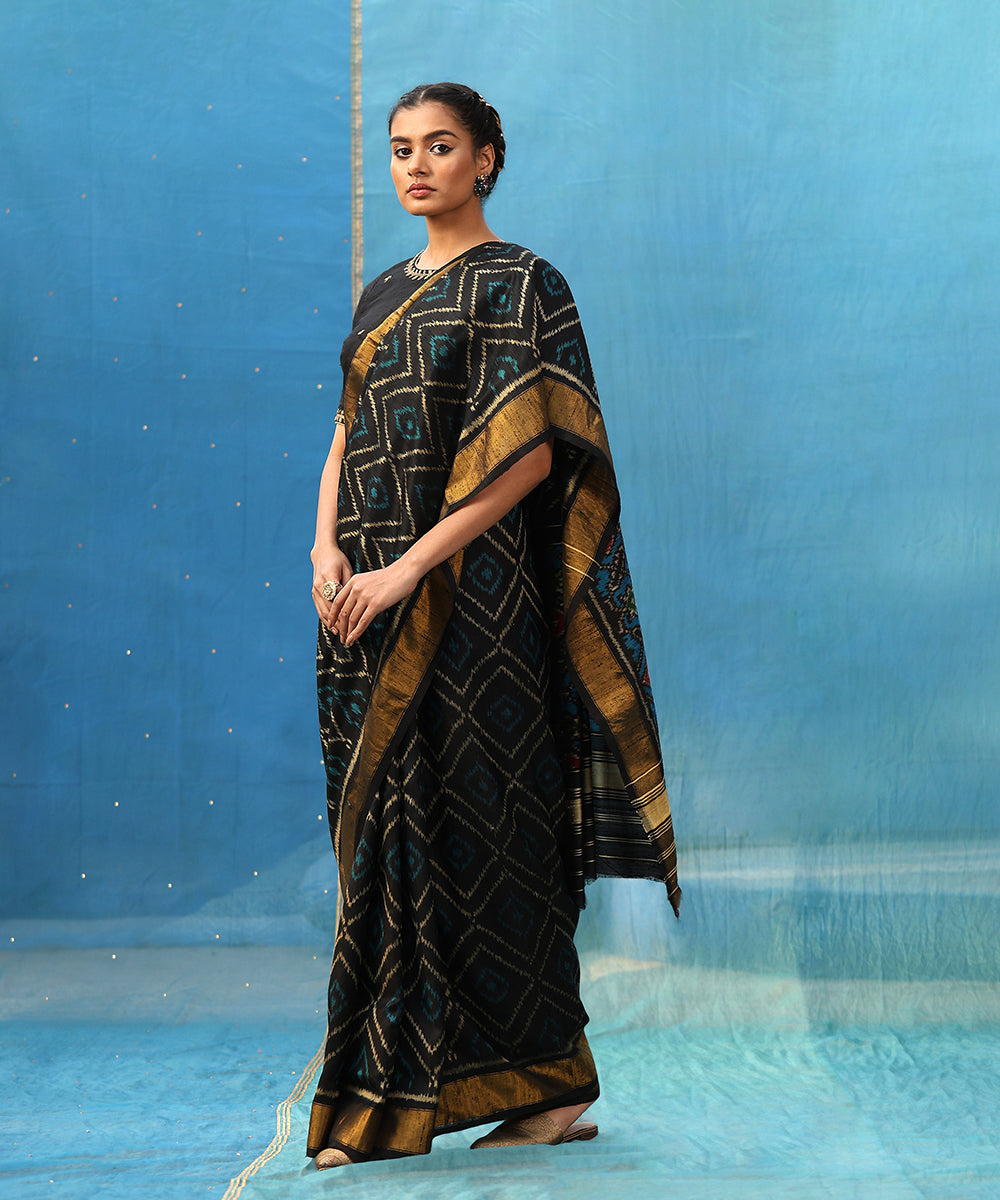 Blue_And_Black_Handloom_Pure_Raw_Silk_Ikat_Patola_Saree_With_Tissue_Border_WeaverStory_01