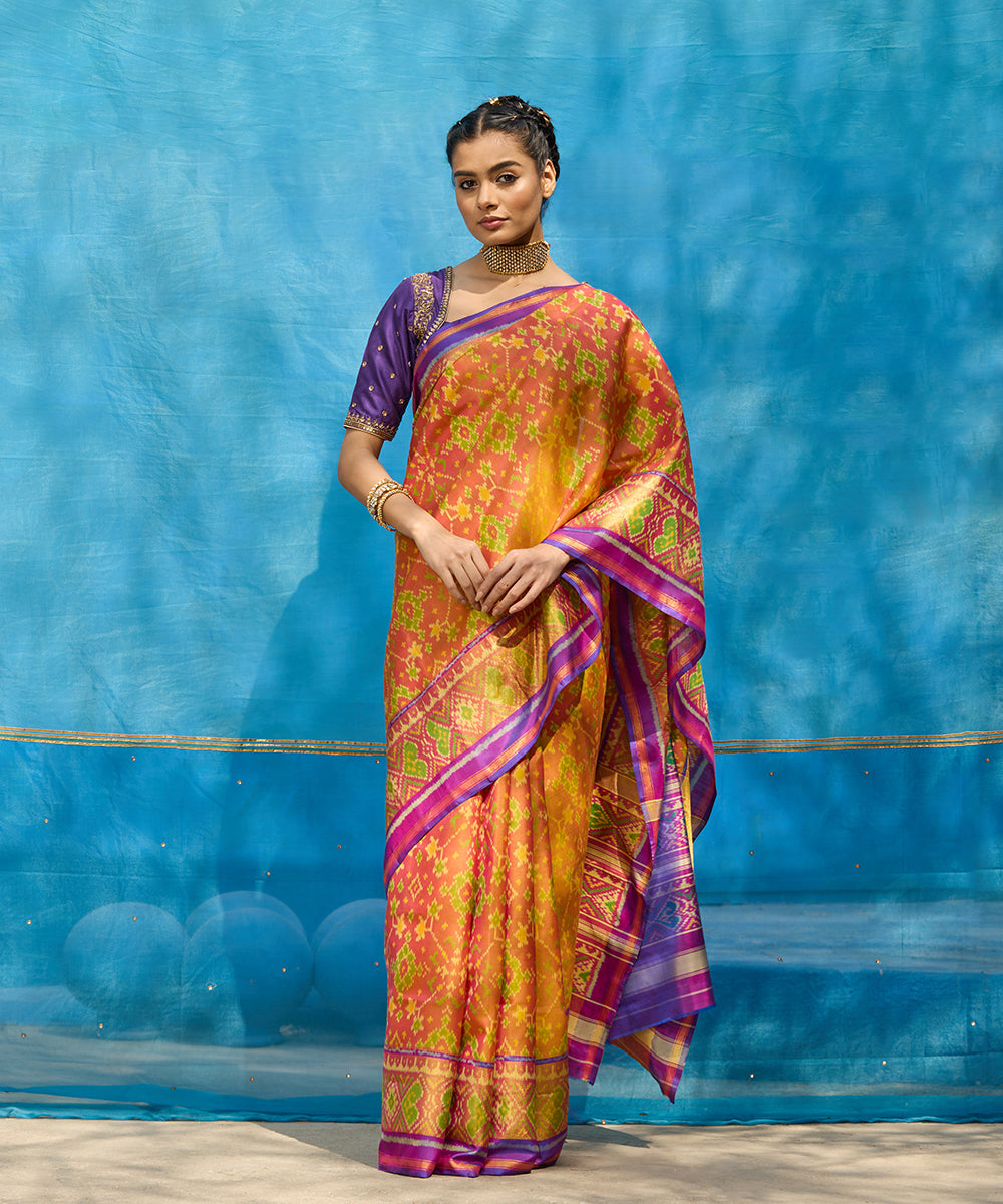 Peach_And_Purple_Handloom_Pure_Mulberry_Silk_Ikat_Patola_Saree_WeaverStory_01