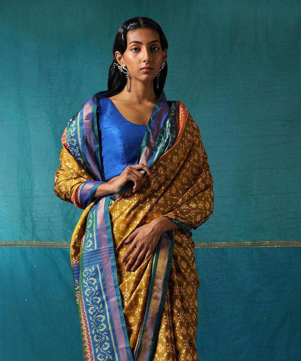 Mustard_Handloom_Pure_Mulberry_Silk_Ikat_Patola_Saree_With_Blue_Border_WeaverStory01