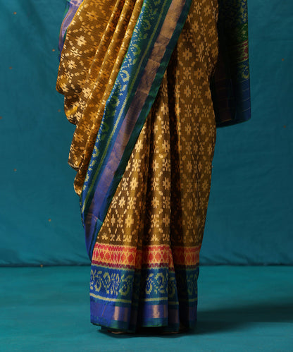 Mustard_Handloom_Pure_Mulberry_Silk_Ikat_Patola_Saree_With_Blue_Border_WeaverStory04