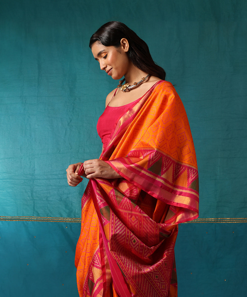Orange_And_Pink_Handloom_Pure_Mulberry_Silk_Ikat_Patola_Saree_With_Pink_Temple_Border_WeaverStory01