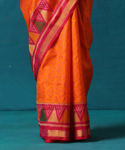 Orange_And_Pink_Handloom_Pure_Mulberry_Silk_Ikat_Patola_Saree_With_Pink_Temple_Border_WeaverStory04