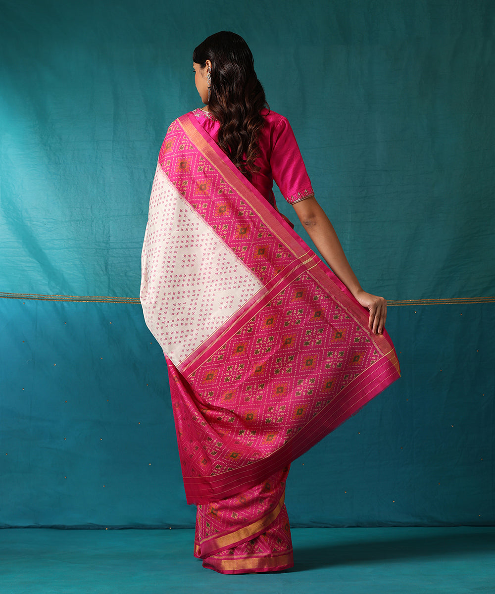 White_And_Pink_Handloom_Pure_Mulberry_Silk_Ikat_Patola_Saree_With_Pink_Border_WeaverStory03