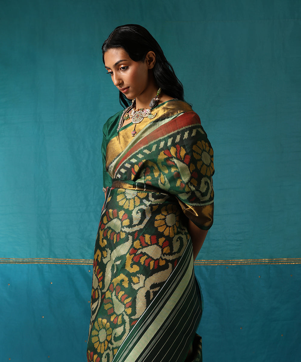 Mustard_And_Green_Handloom_Pure_Mulberry_Silk_Ikat_Patola_Saree_With_Broad_Floral_Border_WeaverStory01