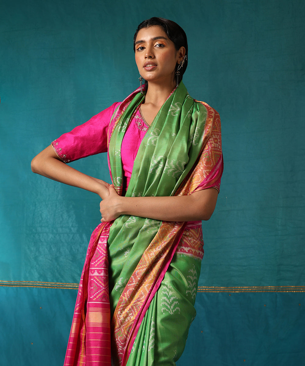 Handloom_Parrot_Green_And_Pink_Pure_Mulberry_Silk_Ikat_Patola_Saree_With_Tree_Motifs_WeaverStory01