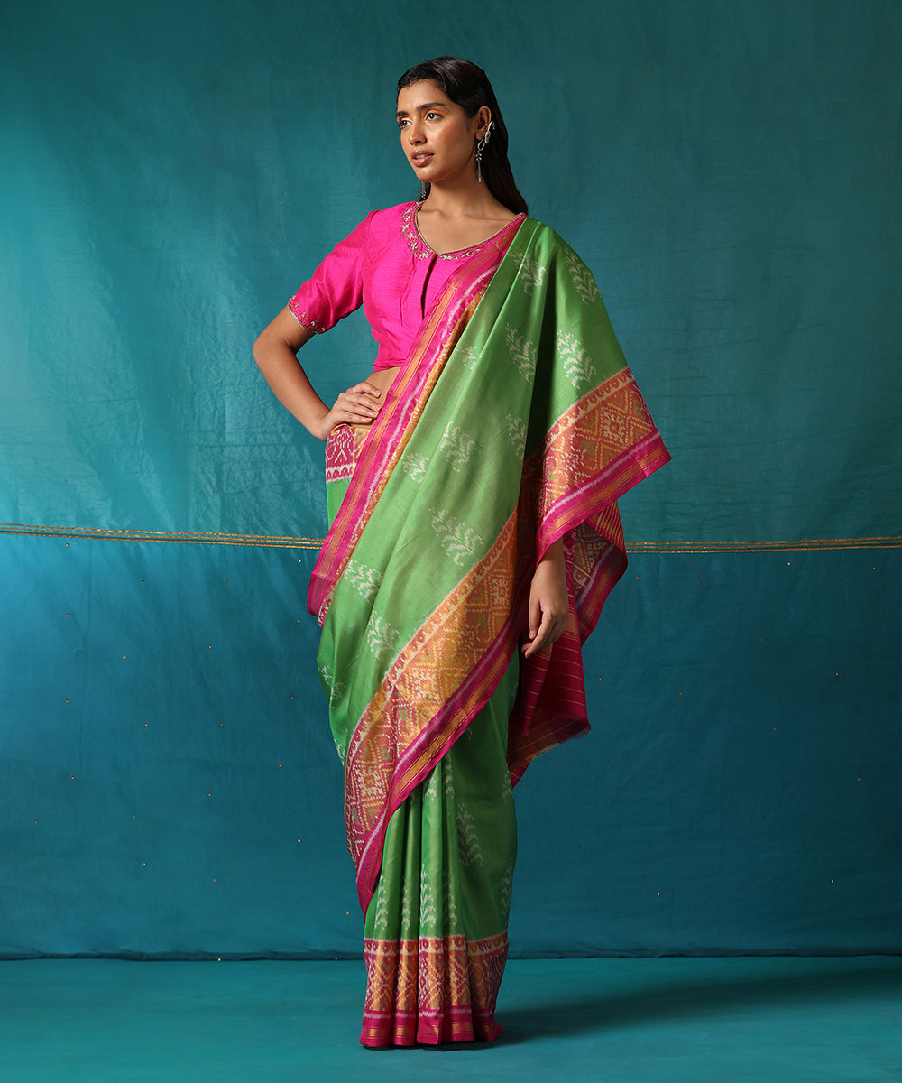 Handloom_Parrot_Green_And_Pink_Pure_Mulberry_Silk_Ikat_Patola_Saree_With_Tree_Motifs_WeaverStory02