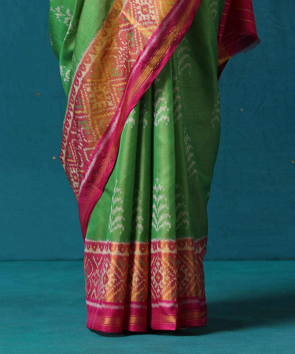 Handloom_Parrot_Green_And_Pink_Pure_Mulberry_Silk_Ikat_Patola_Saree_With_Tree_Motifs_WeaverStory04