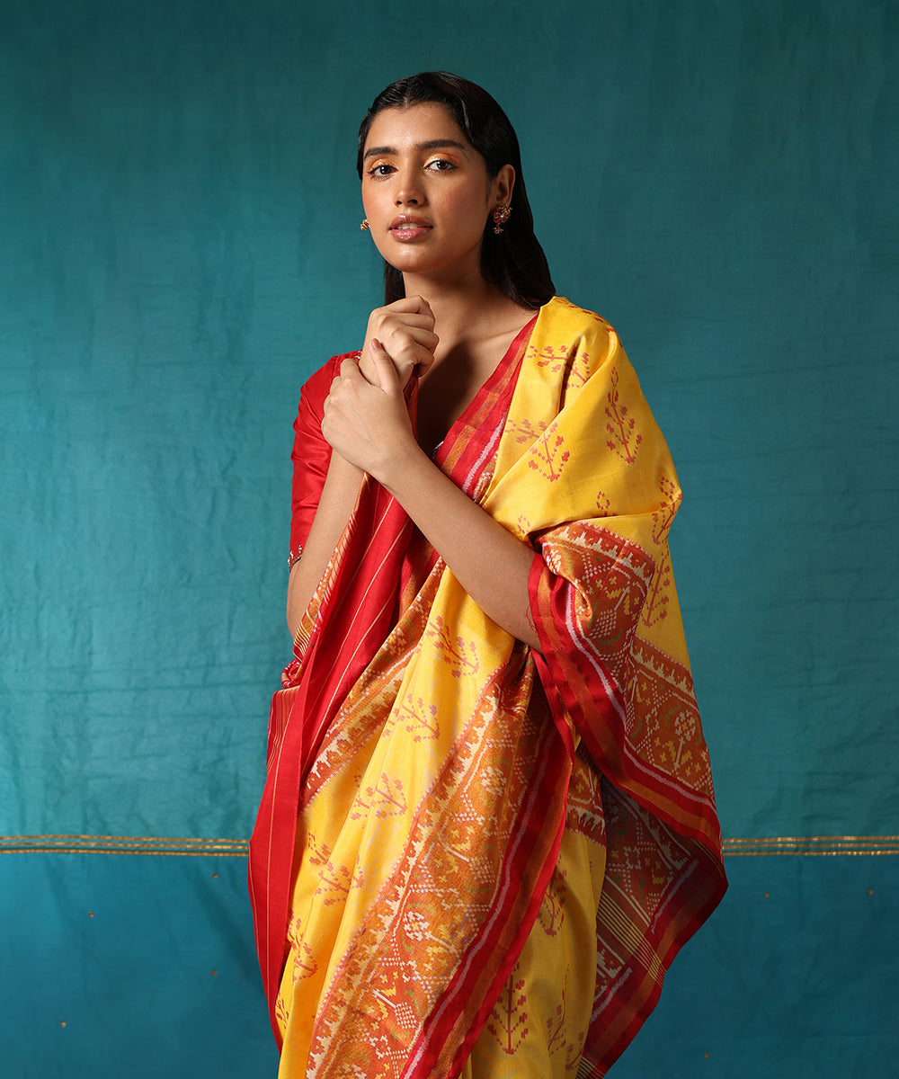 Yellow_And_Red_Handloom_Pure_Mulberry_Silk_Ikat_Patola_Saree_With_Tree_Motifs_WeaverStory01