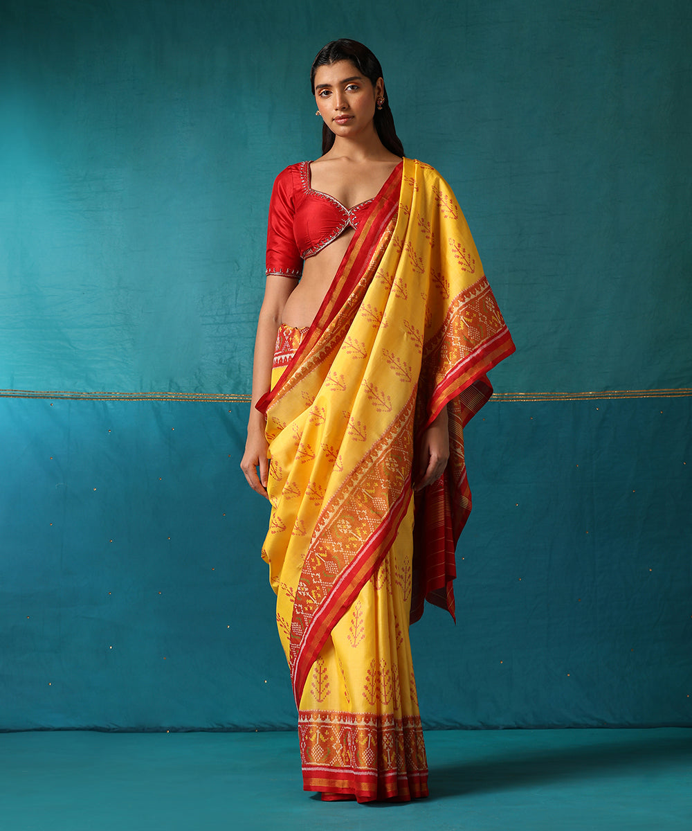 Yellow_And_Red_Handloom_Pure_Mulberry_Silk_Ikat_Patola_Saree_With_Tree_Motifs_WeaverStory02