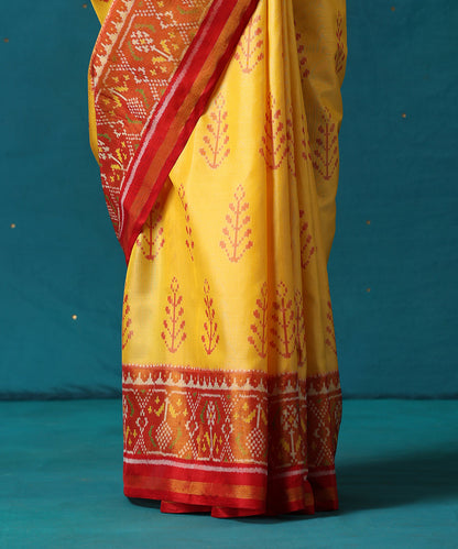 Yellow_And_Red_Handloom_Pure_Mulberry_Silk_Ikat_Patola_Saree_With_Tree_Motifs_WeaverStory04