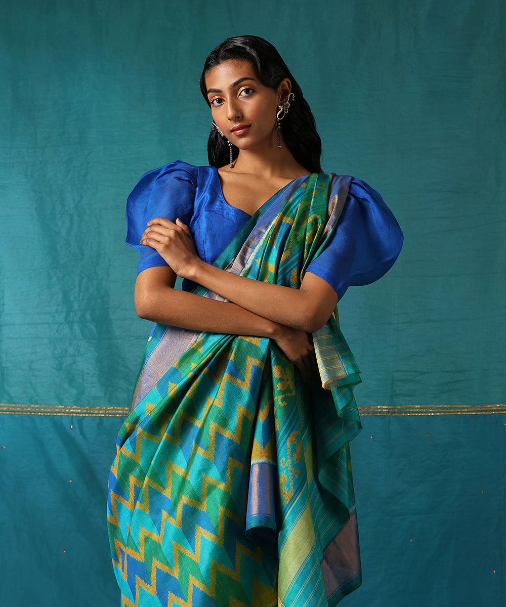 Handloom_Green_And_Blue_Pure_Mulberry_Silk_Ikat_Patola_Saree_With_Zari_Border_WeaverStory01