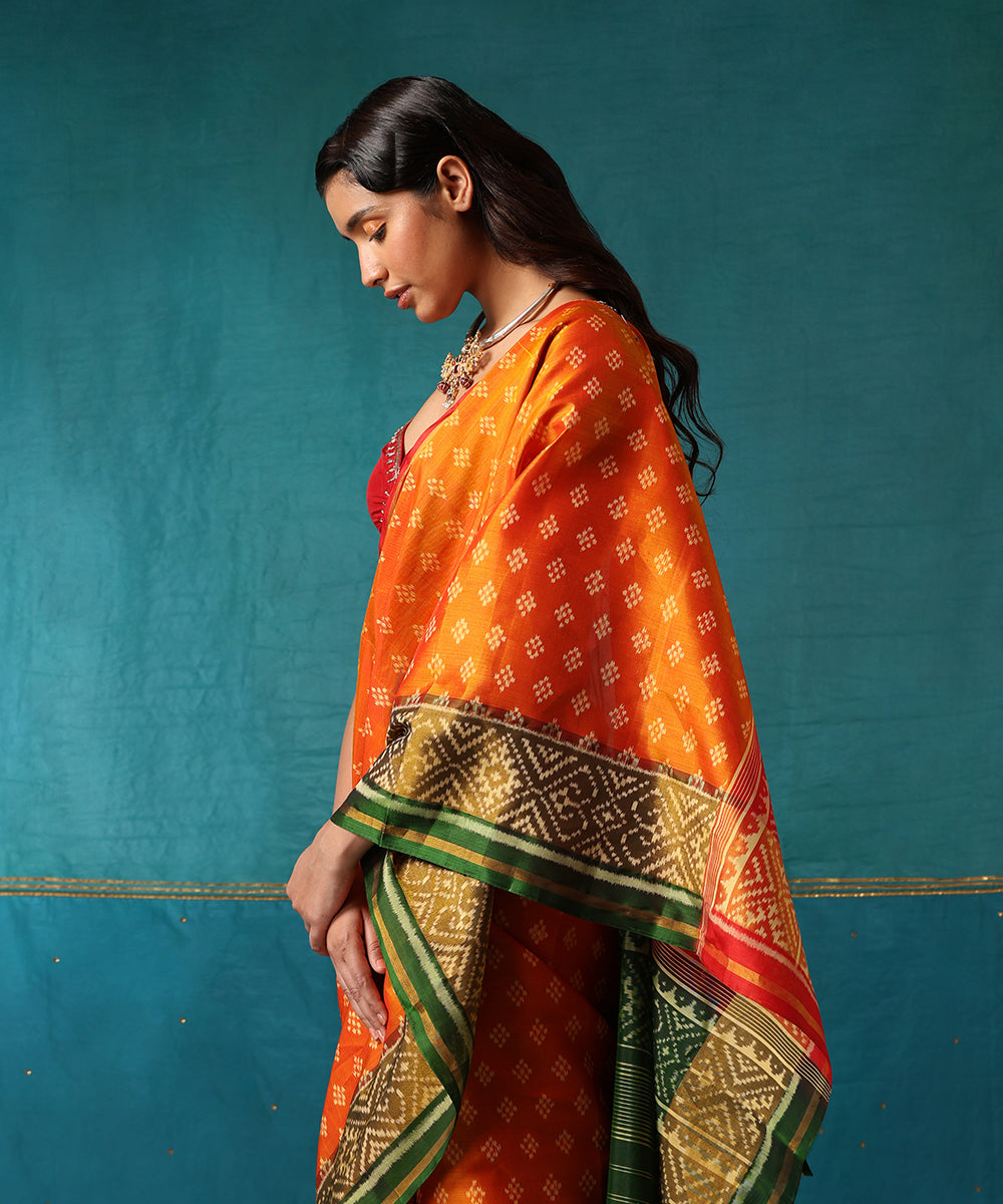 Red_And_Orange_Handloom_Pure_Mulberry_Silk_Ikat_Patola_Saree_With_Green_Geometrical_Border_WeaverStory01
