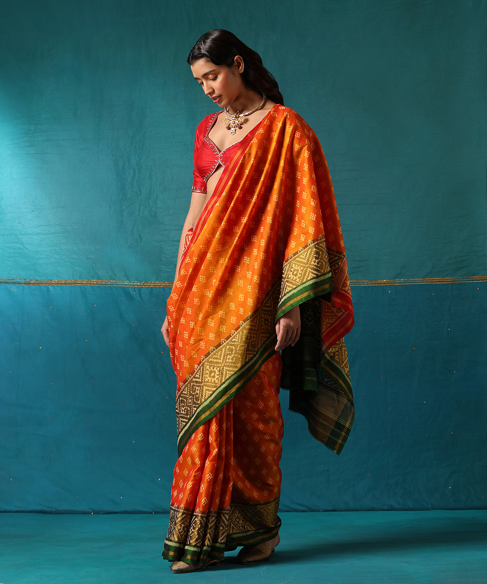 Red_And_Orange_Handloom_Pure_Mulberry_Silk_Ikat_Patola_Saree_With_Green_Geometrical_Border_WeaverStory02