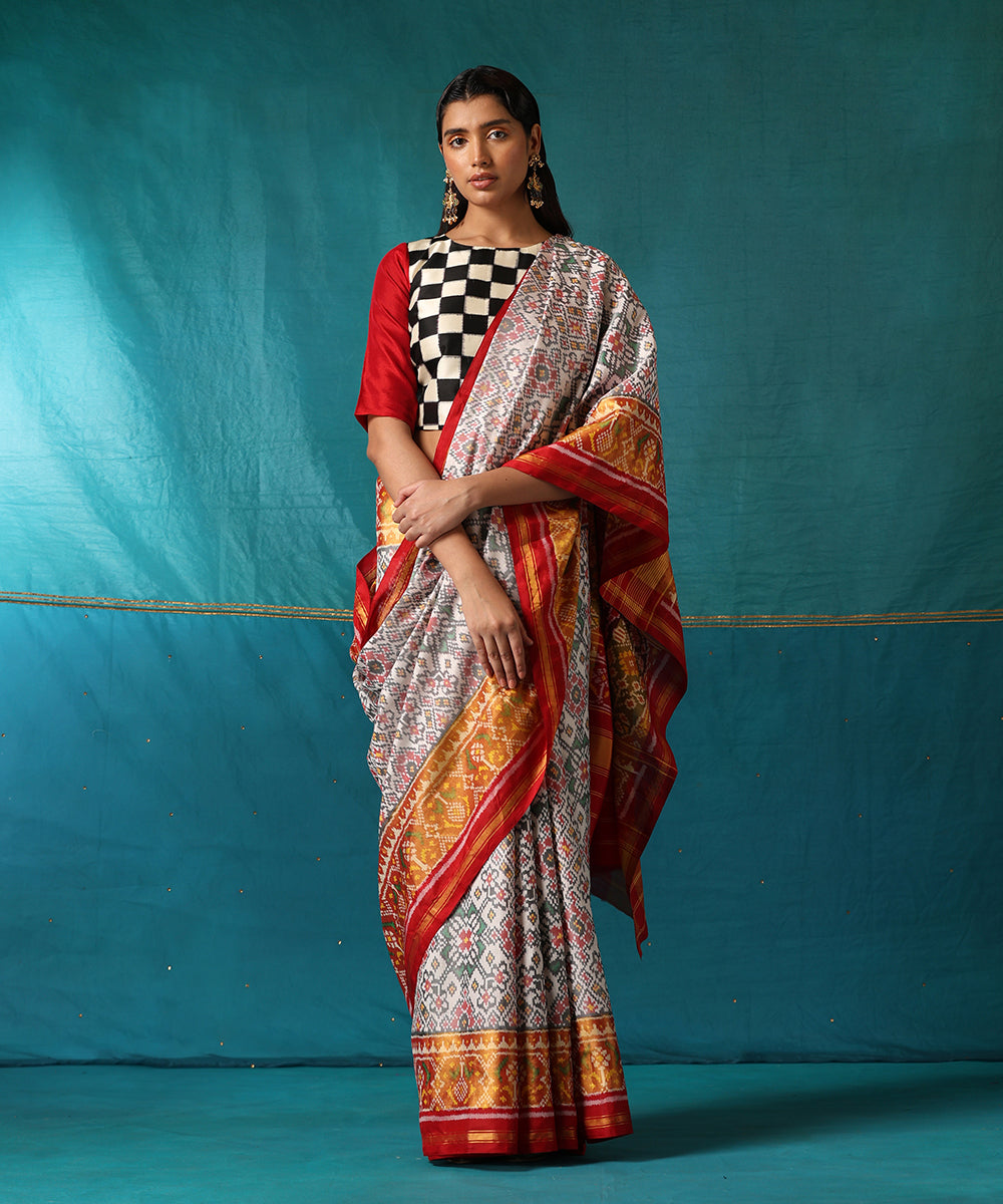Handloom_White_And_Red_Pure_Mulberry_Silk_Ikat_Patola_Saree_With_Red_Border_WeaverStory02