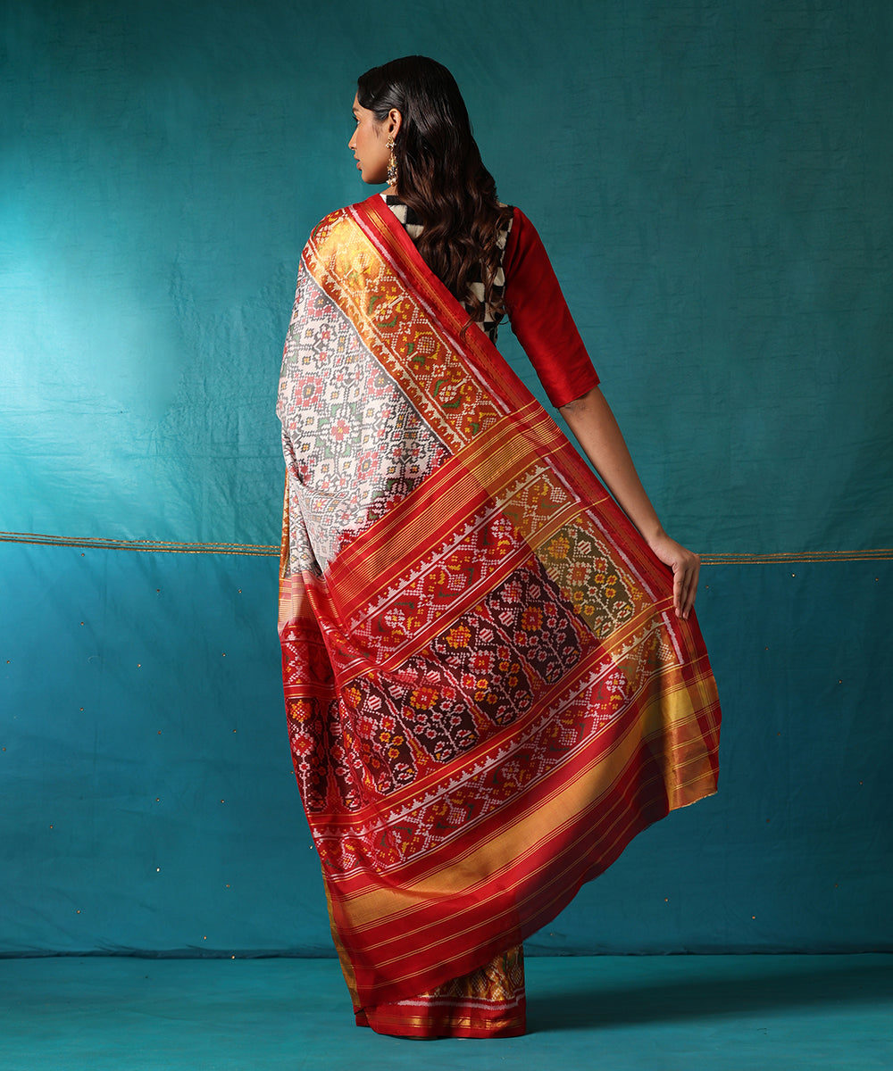 Handloom_White_And_Red_Pure_Mulberry_Silk_Ikat_Patola_Saree_With_Red_Border_WeaverStory03