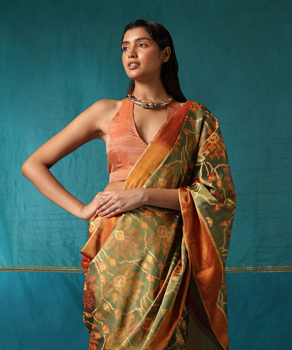 Handloom_Green_And_Mustard_Pure_Mulberry_Silk_Ikat_Patola_Saree_With_Big_Flower_Jaal_WeaverStory01