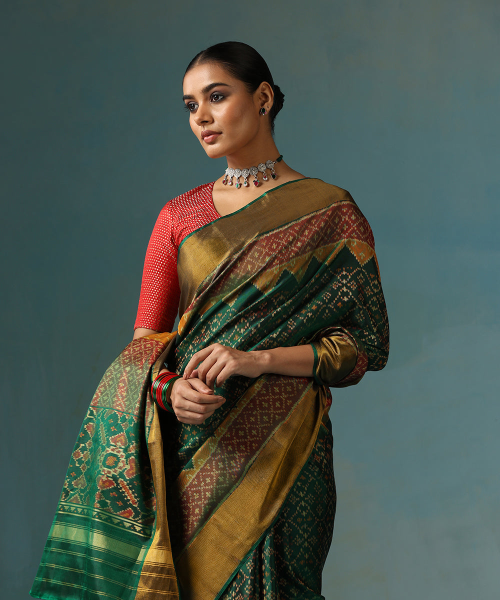 Handloom_Geen_Pure_Mulberry_Silk_Ikat_Patola_Saree_With_Gold_Zari_Border_WeaverStory_01