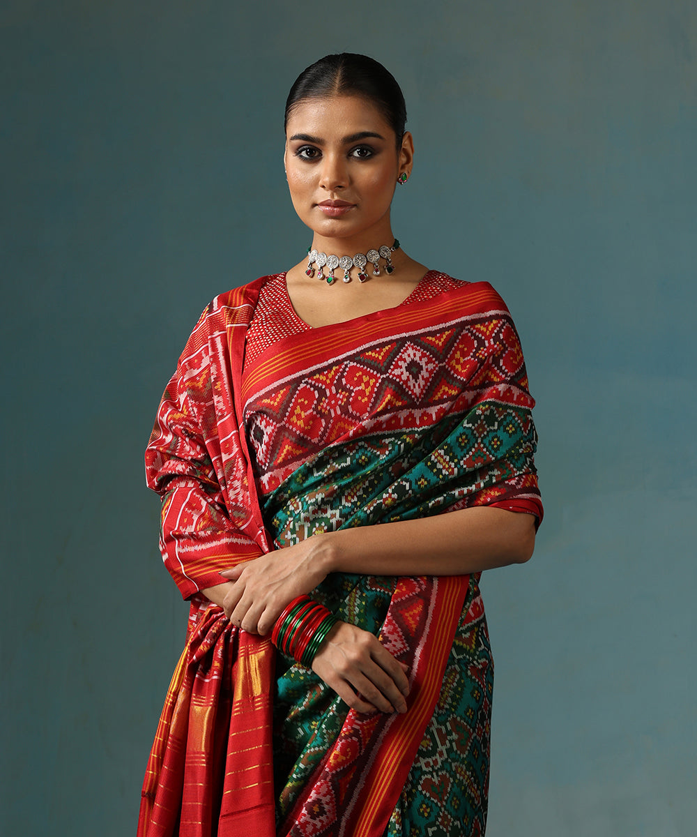 Handloom_Green_And_Red_Pure_Mulberry_Silk_Ikat_Patola_Saree_With_Geometric_Motif_WeaverStory_01