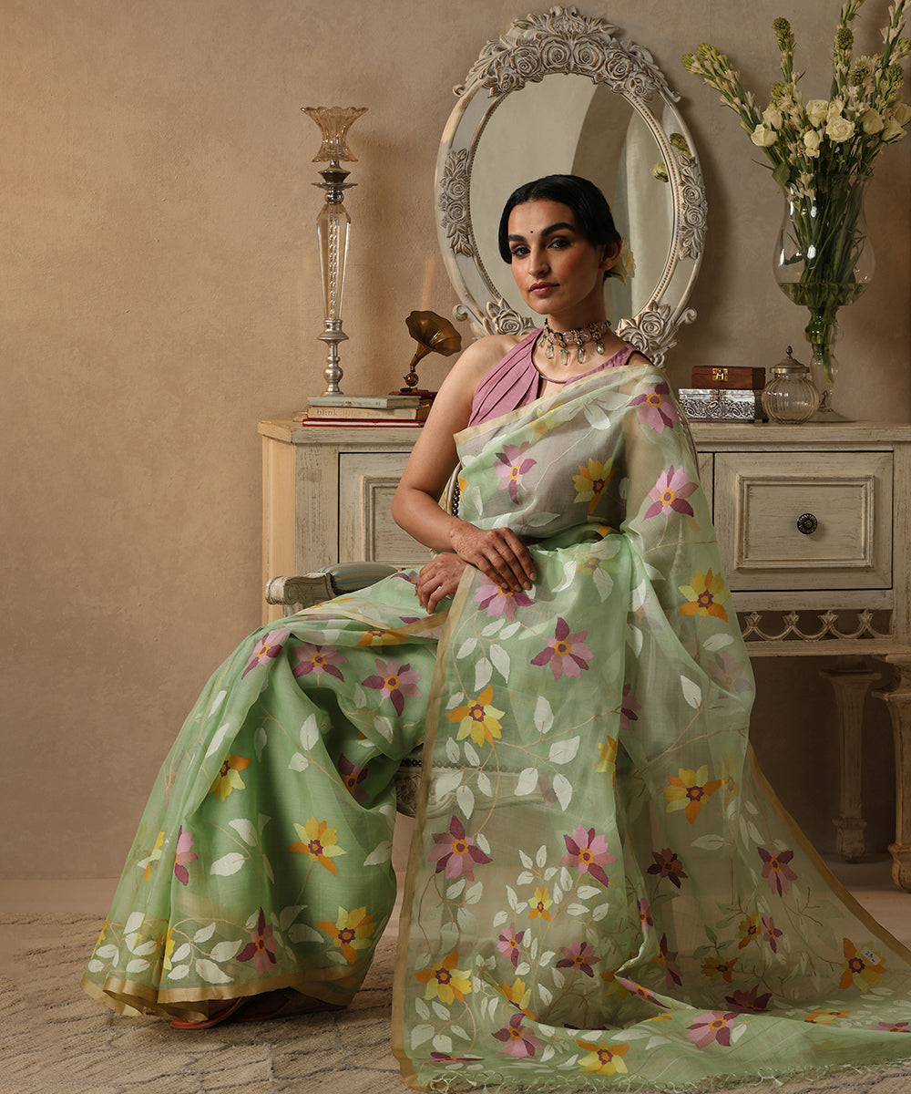 Phuloboti_Handloom_Pistachio_Green_Muslin_Jamdani_Saree_With_Floral_Jaal_All_Over_WeaverStory_01