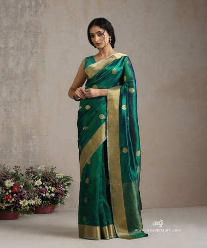 Handloom_Peacock_Green_Silk_Chanderi_Saree_With_Rangoli_Boota_And_Gold_Saffron_Border_WeaverStory_02