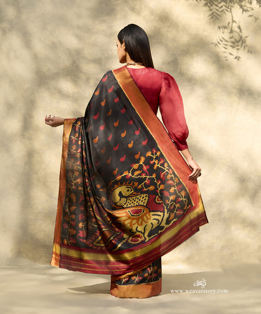 Black_Handloom_Pure_Mulberry_Silk_Ikat_Patola_Saree_With_Big_Peacock_Motif_On_Pallu_And_Gold_Zari_Border_WeaverStory_03