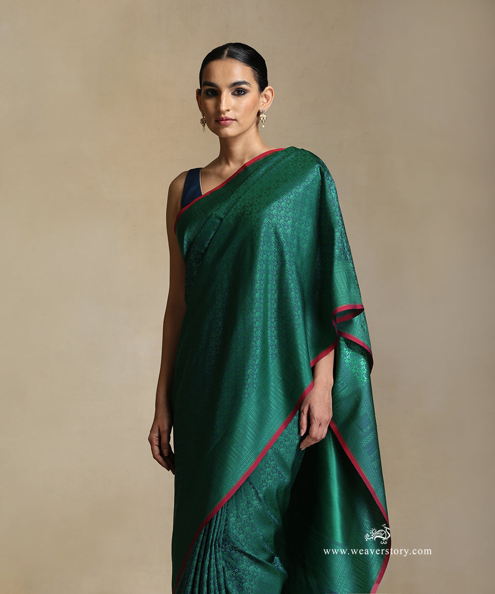 Teal_Handloom_Pure_Katan_Silk_Tanchoi_Banarasi_Saree_With_Green_Jaal_And_Pink_Selvedge_WeaverStory_01