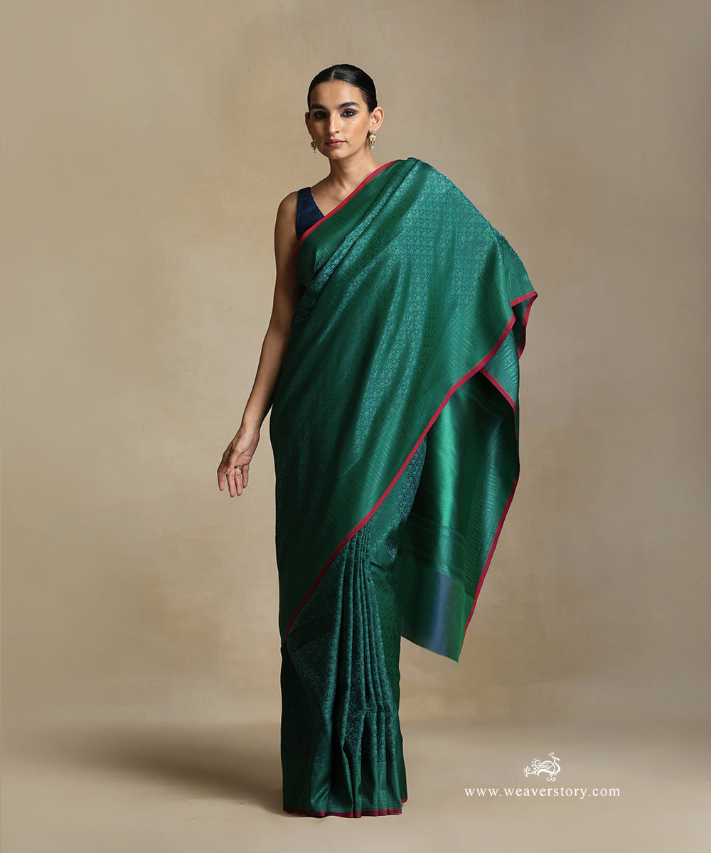 Teal_Handloom_Pure_Katan_Silk_Tanchoi_Banarasi_Saree_With_Green_Jaal_And_Pink_Selvedge_WeaverStory_02