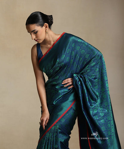 Handloom_Blue_Pure_Katan_Silk_Tanchoi_Banarasi_Saree_With_Green_Flower_Jaal_And_Zigzag_Border_WeaverStory_01