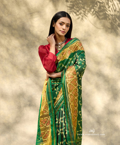 Bottle_Green_Handloom_Pure_Mulberry_Silk_Ikat_Patola_Saree_With_Gold_Zari_Booti_And_Tissue_Border_WeaverStory_02