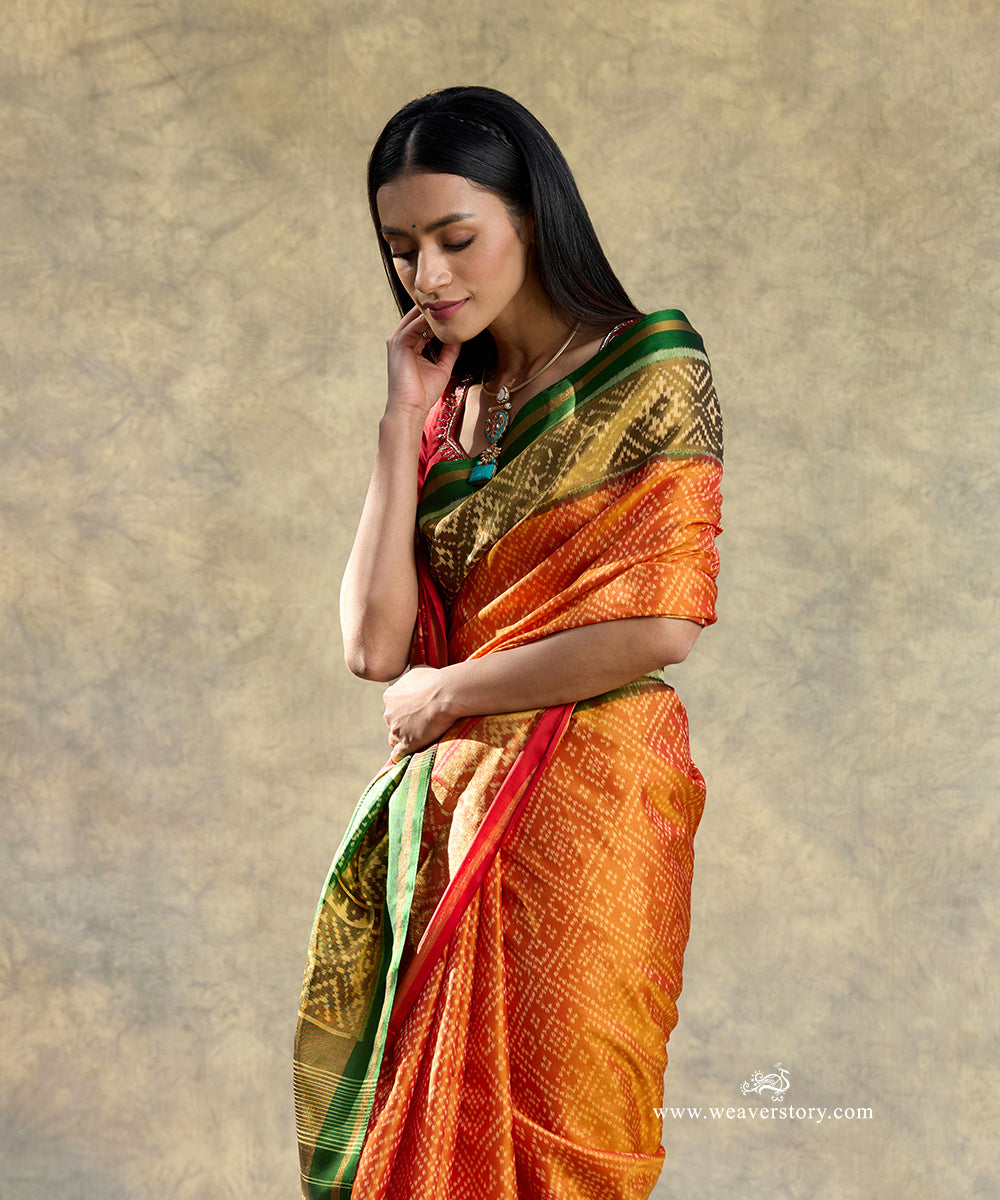 Red_And_Orange_Handloom_Pure_Mulberry_Silk_Ikat_Patola_Saree_With_Green_Pallu_WeaverStory_02